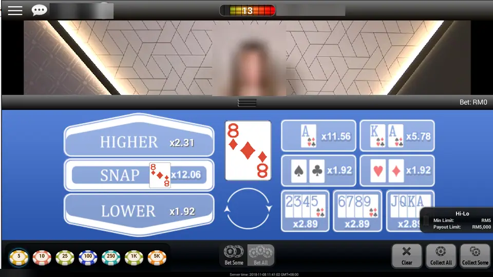 Hi Lo on NTC33 with an 8 of diamonds showing, Higher at x2.31, Snap at x12.06 and Lower at x1.92, side bets and chips from 5 to 5K below, presenter, player ID and balance blurred